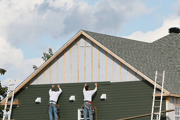Professional Siding technician working in Holtsville, NY